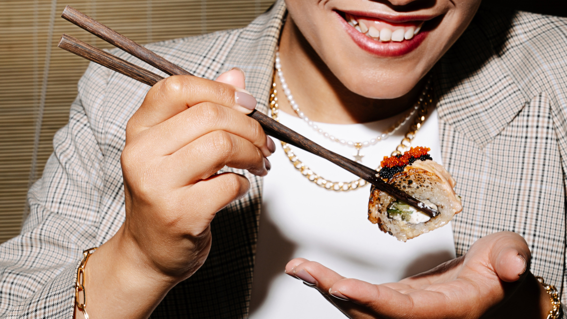 Women Eating Sushi At Restaurant