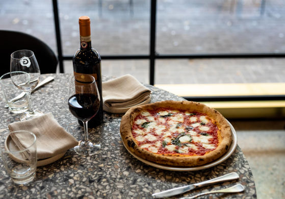 Pizza Served with a Glass of Wine