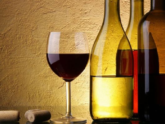 Wine Bottles with a Glass of Wine